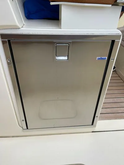  Yacht Photos Pics Stainless steel door on 2016 Scout 350 LXF boat, featuring Isotherm label.
