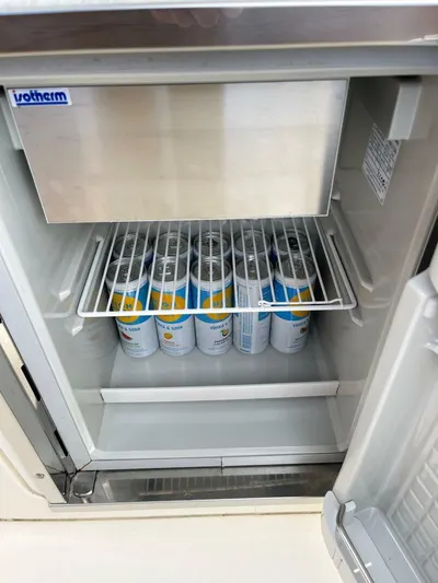  Yacht Photos Pics Mini fridge stocked with canned drinks on a 2016 Scout 350 LXF boat.