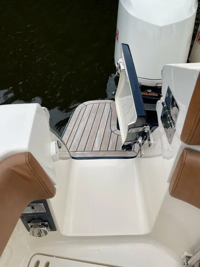 Yacht Photos Pics 2016 Scout 350 LXF boat with open transom door and teak swim platform.