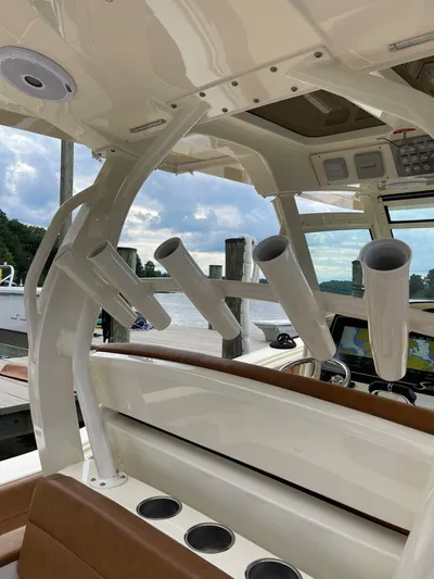  Yacht Photos Pics 2016 Scout 350 LXF boat interior with rod holders and navigation equipment.