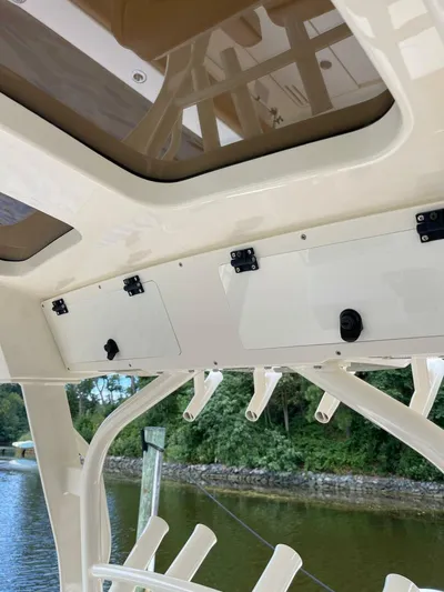  Yacht Photos Pics 2016 Scout 350 LXF boat interior with storage compartments and rod holders.