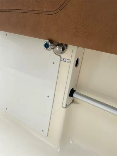  Yacht Photos Pics 2016 Scout 350 LXF boat interior detail with metal fixture and brown upholstery.