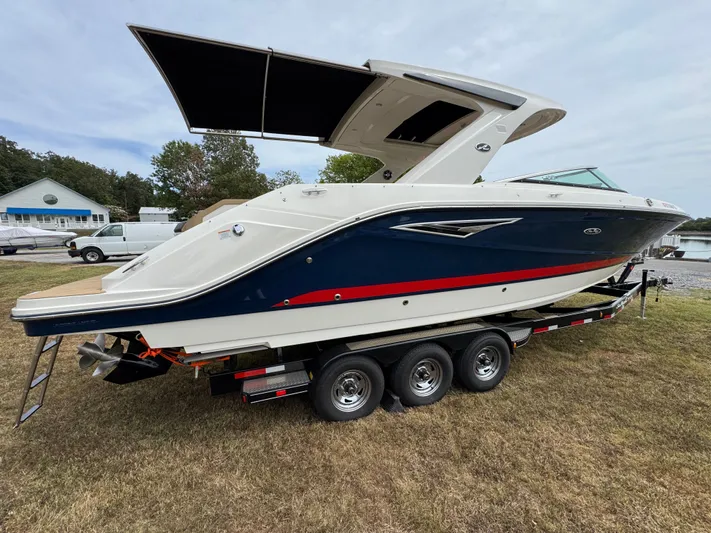  Yacht Photos Pics 2022 Sea Ray SLX 310 boat on trailer, featuring sleek design and modern amenities.