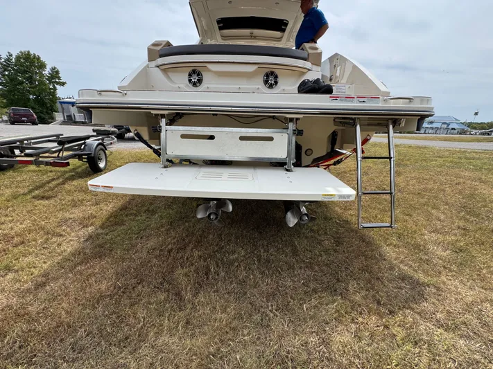  Yacht Photos Pics 2022 Sea Ray SLX 310 boat rear view with swim platform and ladder.