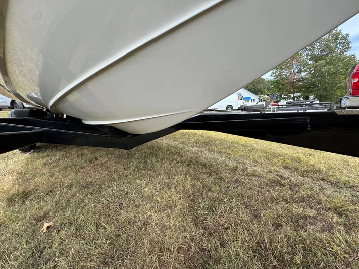  Yacht Photos Pics 2022 Sea Ray SLX 310 boat on trailer, grassy area, side view.