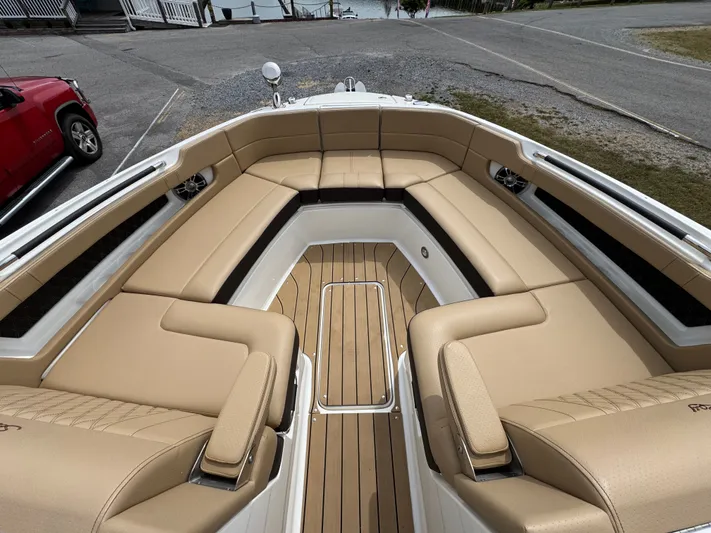 Yacht Photos Pics 2022 Sea Ray SLX 310 boat with tan leather seating and teak flooring.