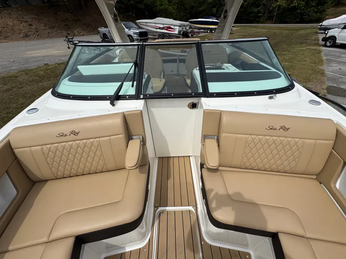  Yacht Photos Pics 2022 Sea Ray SLX 310 boat interior with tan leather seating and wood flooring.