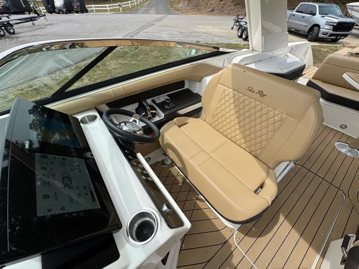  Yacht Photos Pics 2022 Sea Ray SLX 310 boat interior with tan leather seating and modern dashboard.