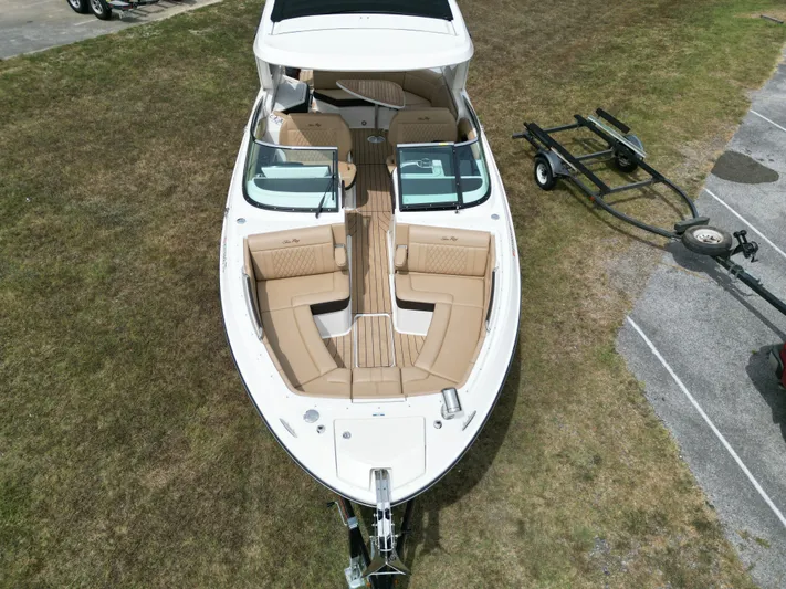  Yacht Photos Pics 2022 Sea Ray SLX 310 boat on grass with trailer, aerial view.