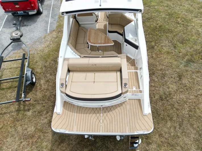  Yacht Photos Pics 2022 Sea Ray SLX 310 boat with tan seating and wooden deck, aerial view.