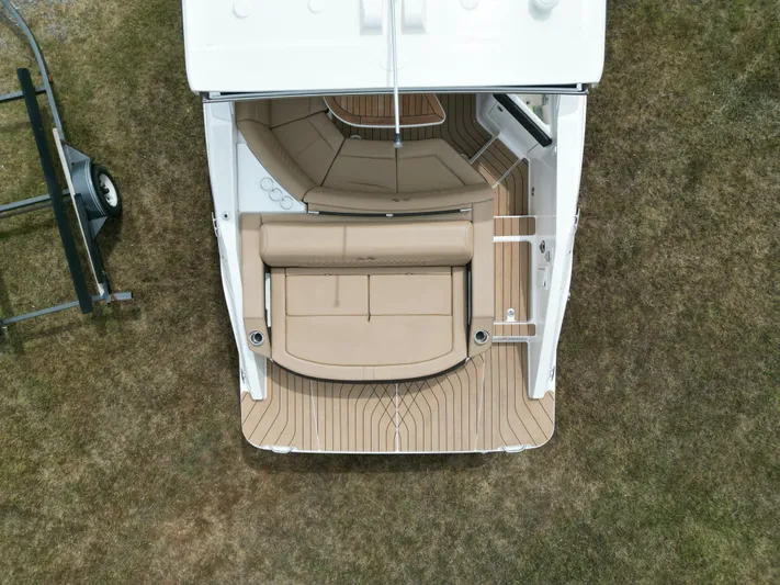  Yacht Photos Pics Overhead view of 2022 Sea Ray SLX 310 boat with beige seating and wooden deck.