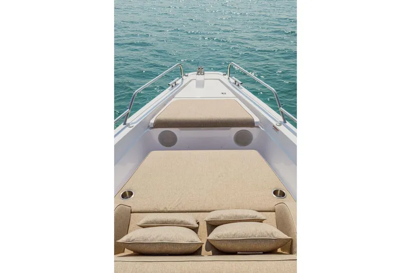  Yacht Photos Pics Axopar 45 XC Cross Cabin 2024 with beige sun deck on water.