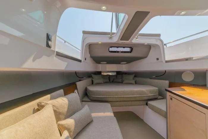  Yacht Photos Pics Interior of 2024 Axopar 45 XC Cross Cabin with cozy seating.