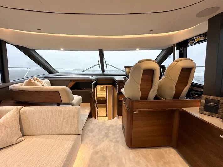 F65020 Yacht Photos Pics Luxurious interior of 2024 Princess F65 yacht with plush seating and modern helm.