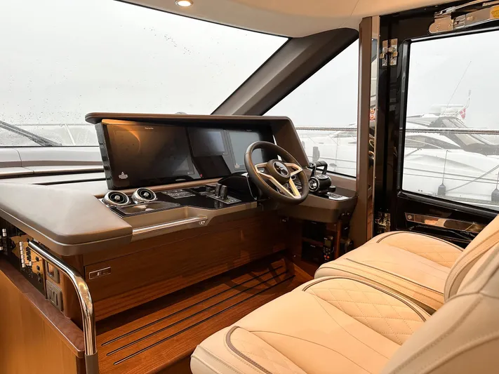F65020 Yacht Photos Pics Luxurious 2024 Princess F65 yacht interior with modern helm and plush seating.
