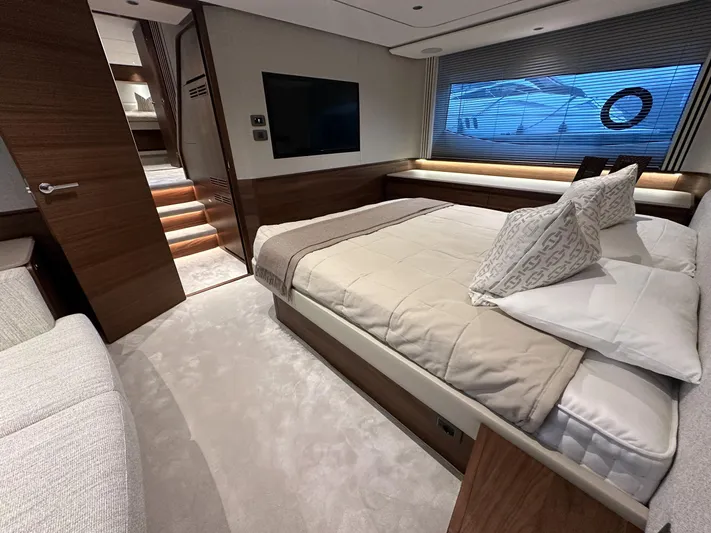 F65020 Yacht Photos Pics Luxurious bedroom interior of 2024 Princess F65 yacht, featuring elegant design and modern amenities.