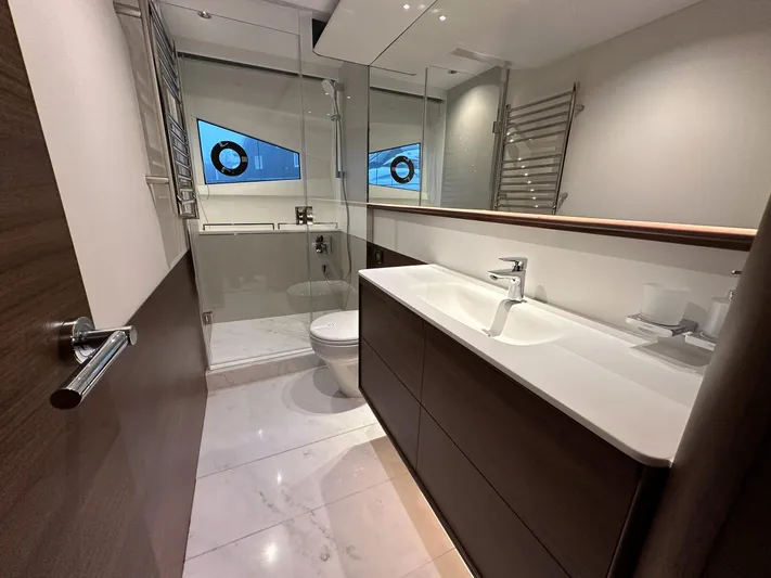 F65020 Yacht Photos Pics Luxurious bathroom in 2024 Princess F65 yacht with modern fixtures and elegant design.