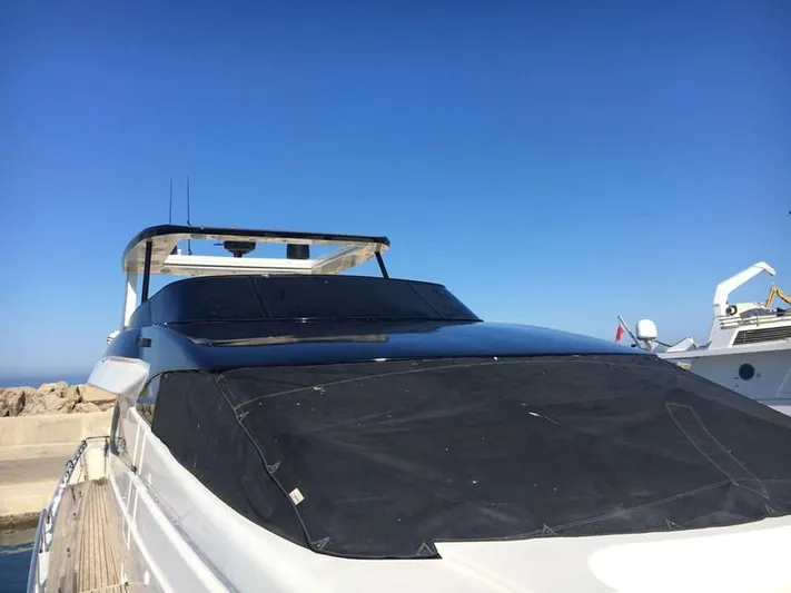 Yaiza Yacht Photos Pics Astondoa 82 GLX yacht from 2000 docked under clear blue sky.