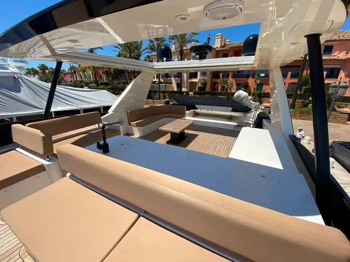 Yaiza Yacht Photos Pics Luxurious 2000 Astondoa 82 GLX yacht with spacious outdoor seating and elegant design.