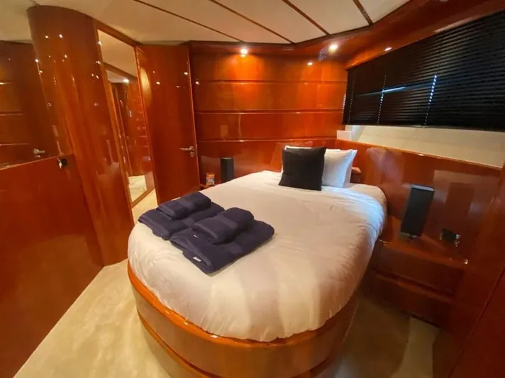 Yaiza Yacht Photos Pics Luxurious cabin interior of 2000 Astondoa 82 GLX yacht with elegant wood paneling.