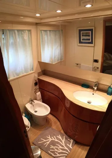 Yaiza Yacht Photos Pics Luxurious bathroom in a 2000 Astondoa 82 GLX yacht with modern fixtures and elegant design.
