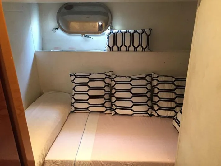 Yaiza Yacht Photos Pics Cozy cabin bed with geometric pillows in 2000 Astondoa 82 GLX yacht.
