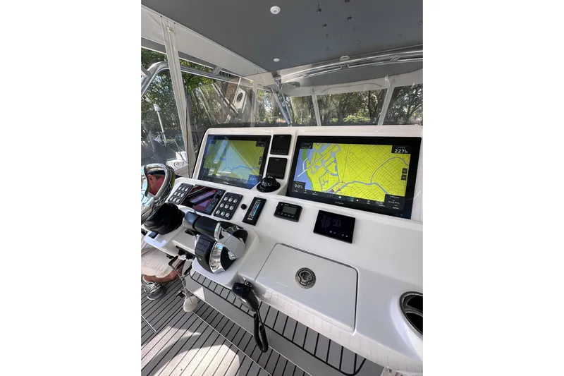 No Name Yacht Photos Pics Cockpit of 2020 Intrepid 409 Valor with navigation screens and controls.