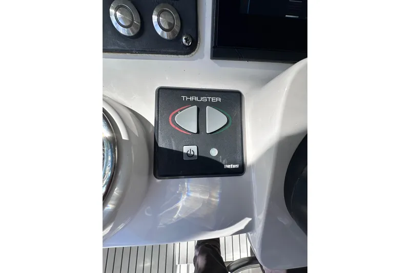 No Name Yacht Photos Pics Control panel of a 2020 Intrepid 409 Valor boat featuring a thruster button.