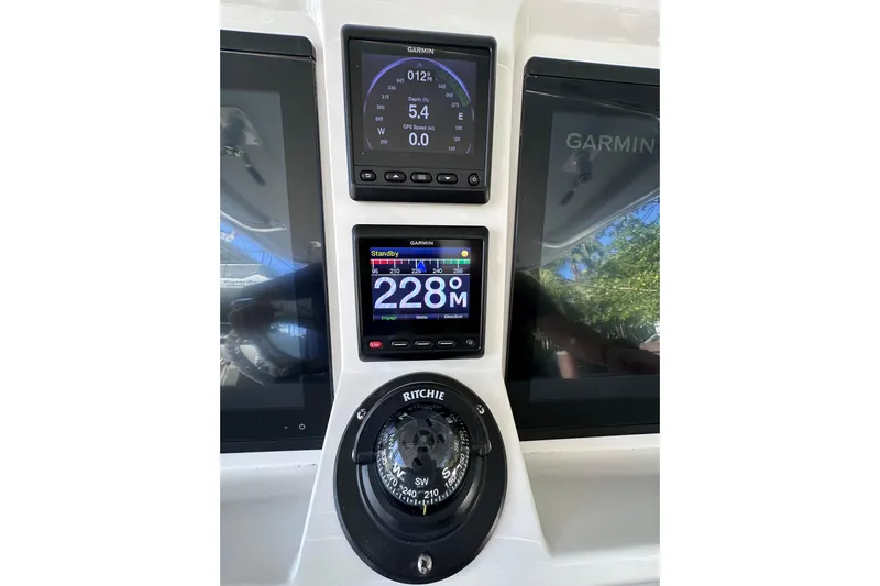 No Name Yacht Photos Pics Intrepid 409 Valor 2020 boat dashboard with Garmin displays and Ritchie compass.