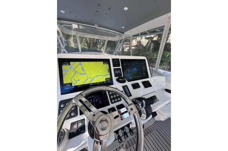 No Name Yacht Photos Pics Cockpit of 2020 Intrepid 409 Valor with navigation screens and steering wheel.