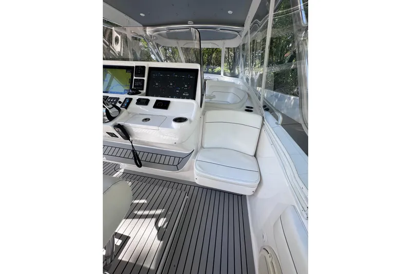 No Name Yacht Photos Pics 2020 Intrepid 409 Valor boat interior with modern dashboard and seating.