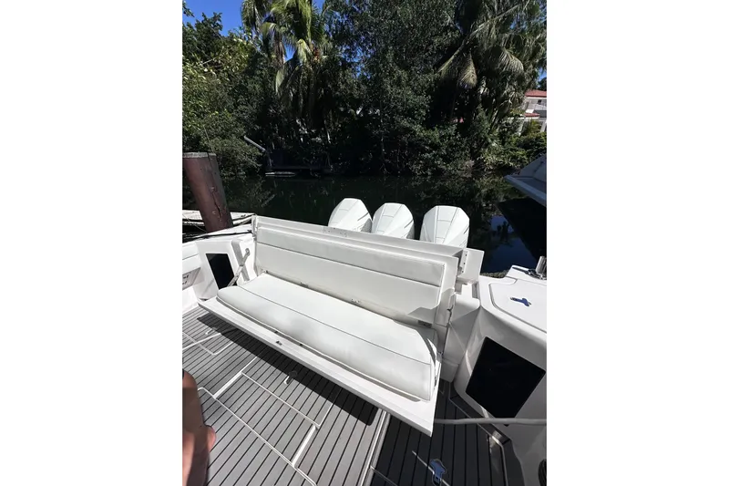 No Name Yacht Photos Pics 2020 Intrepid 409 Valor boat with white seating and triple outboard engines.