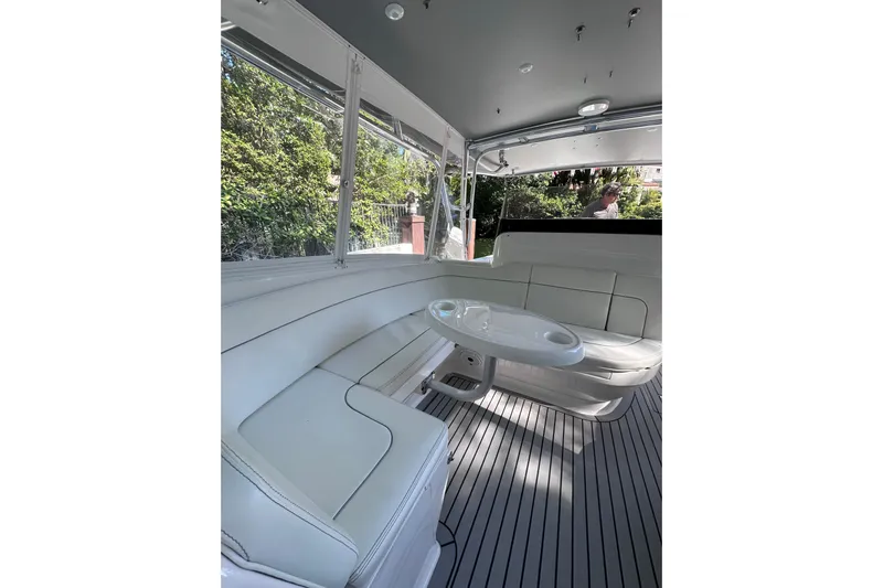 No Name Yacht Photos Pics Luxurious interior of 2020 Intrepid 409 Valor boat with sleek seating and table.