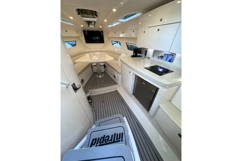 No Name Yacht Photos Pics Interior of 2020 Intrepid 409 Valor boat with modern kitchen and seating area.