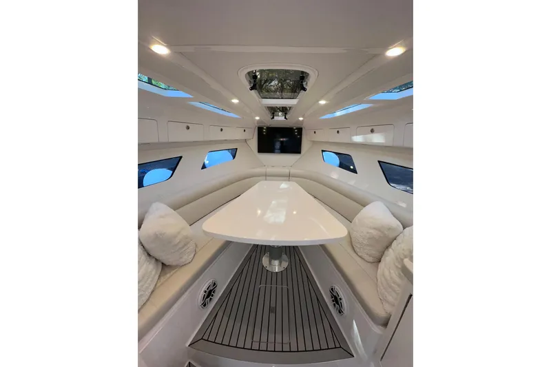 No Name Yacht Photos Pics Luxurious interior of 2020 Intrepid 409 Valor yacht with elegant seating and modern design.