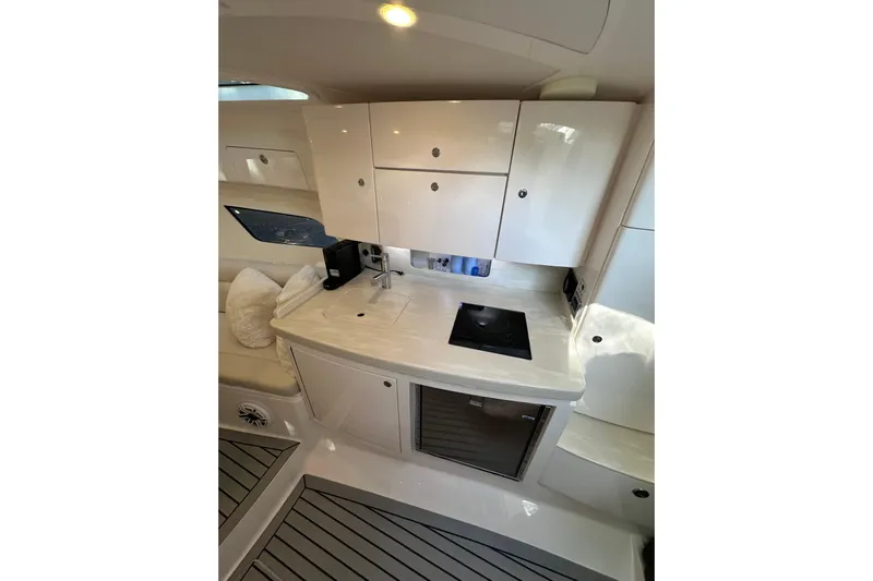 No Name Yacht Photos Pics 2020 Intrepid 409 Valor yacht interior kitchen with modern cabinetry and appliances.