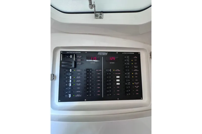 No Name Yacht Photos Pics Intrepid 409 Valor 2020 electrical panel with AC and DC voltage displays.