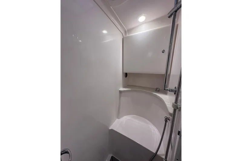 No Name Yacht Photos Pics 2020 Intrepid 409 Valor boat interior shower with sleek, modern design and chrome fixtures.
