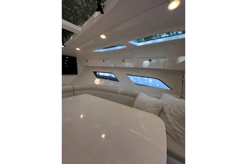 No Name Yacht Photos Pics Luxurious interior of 2020 Intrepid 409 Valor yacht with modern seating and skylights.