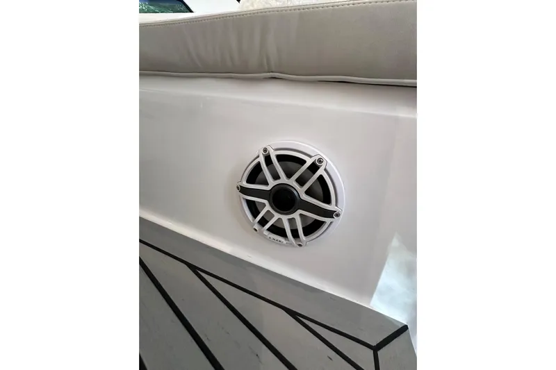 No Name Yacht Photos Pics 2020 Intrepid 409 Valor boat speaker detail with cushioned seating.