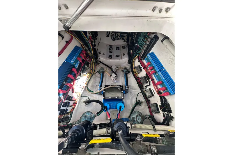 No Name Yacht Photos Pics Engine compartment of a 2020 Intrepid 409 Valor boat, showcasing wiring and components.