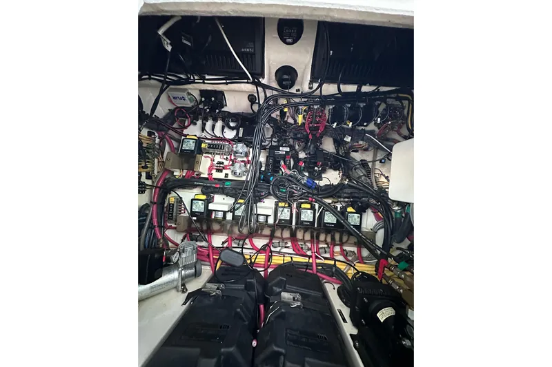 No Name Yacht Photos Pics Engine compartment of a 2020 Intrepid 409 Valor boat, showcasing complex wiring and components.