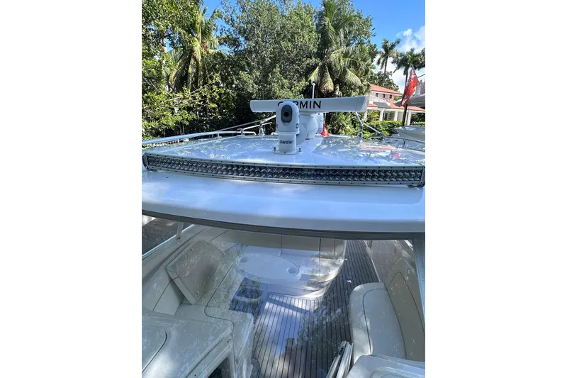 No Name Yacht Photos Pics 2020 Intrepid 409 Valor boat with Garmin radar, surrounded by lush greenery.