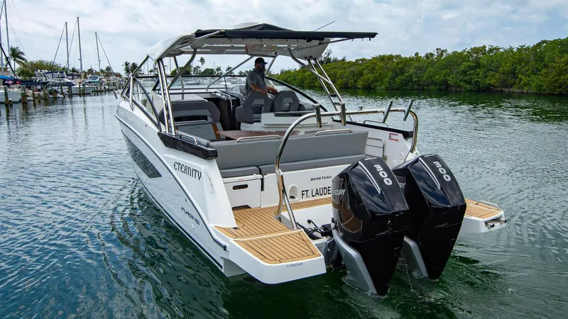 Eternity Yacht Photos Pics 2023 Beneteau Flyer 10 motorboat with dual engines cruising in a serene waterway.