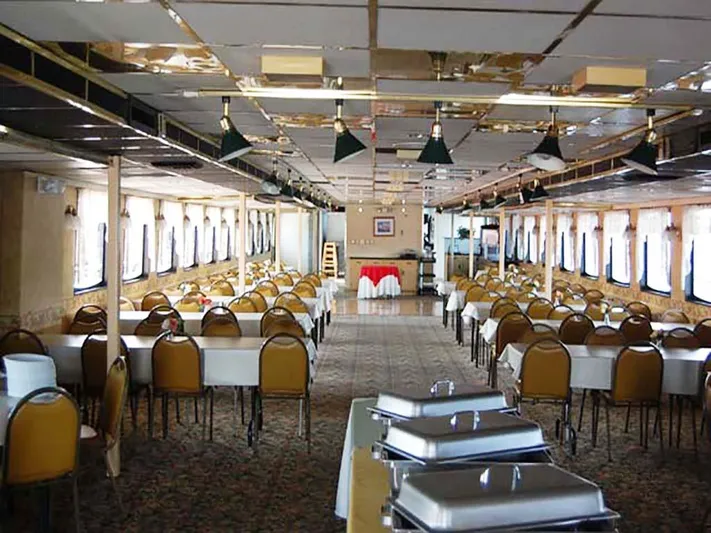 Capt. Jp III Yacht Photos Pics Interior of 1985 Custom Serodino Dinner Boat with elegant dining setup and buffet tables.