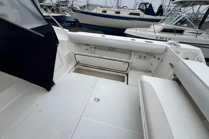 Rock N Reel Yacht Photos Pics 2005 Boston Whaler 305 Conquest boat interior with open storage compartment.