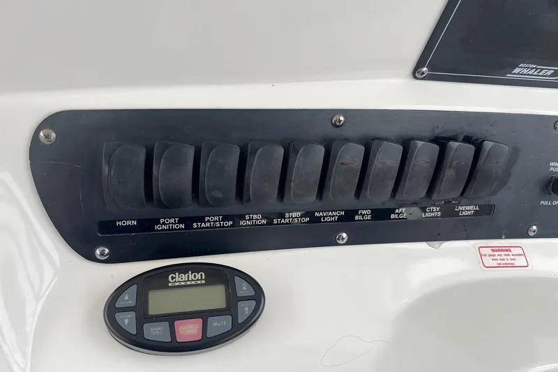 Rock N Reel Yacht Photos Pics Control panel of a 2005 Boston Whaler 305 Conquest boat with Clarion audio system.