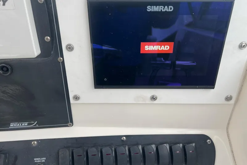 Rock N Reel Yacht Photos Pics Control panel of a 2005 Boston Whaler 305 Conquest with Simrad display.