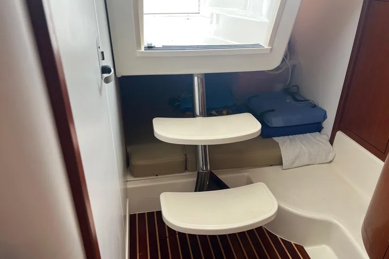 Rock N Reel Yacht Photos Pics Interior cabin of 2005 Boston Whaler 305 Conquest with steps and seating area.