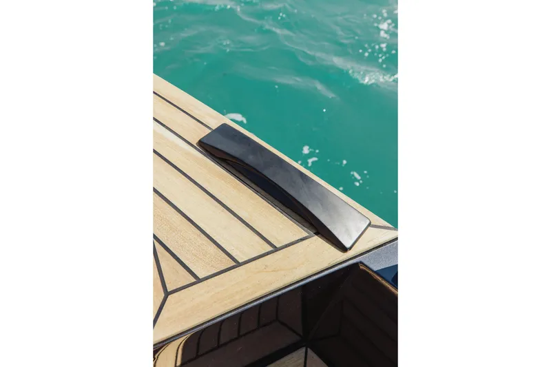  Yacht Photos Pics Teak deck detail of 2026 XO Boats EXPLR 44 against turquoise water.